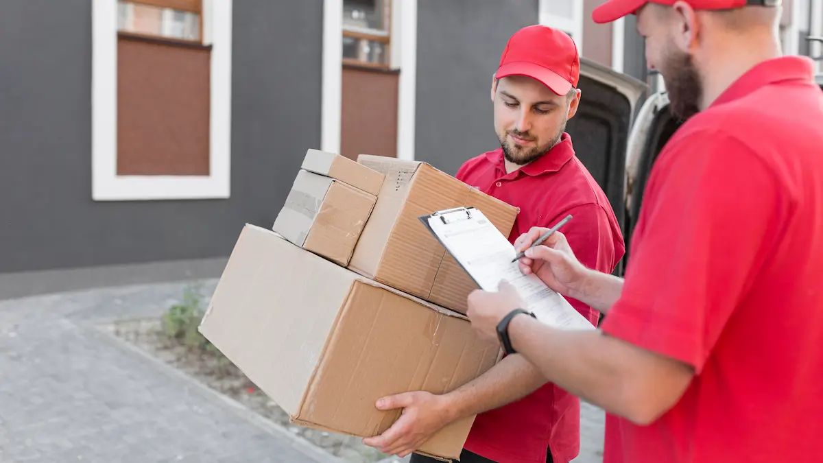Mover carrying packed boxes for an apartment move in Dubai