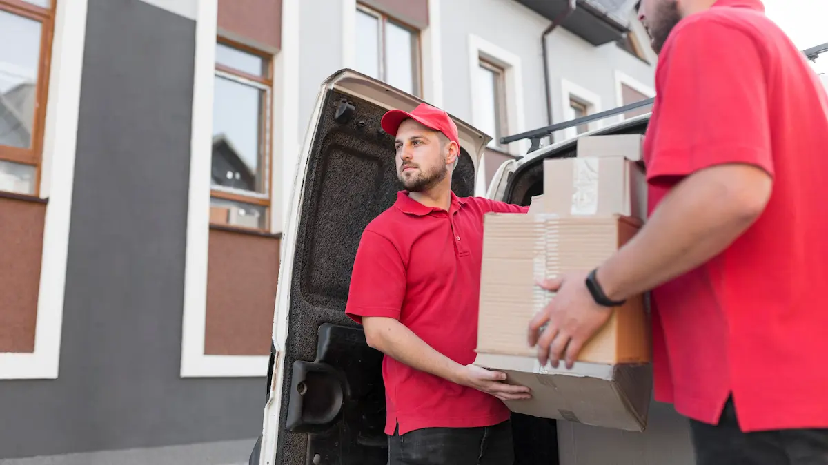 Office movers in Dubai carrying boxes for a commercial relocation